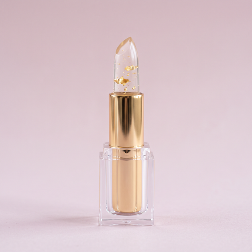 Aura pH Lipstick twisted up showing the clear gold flecked bullet
